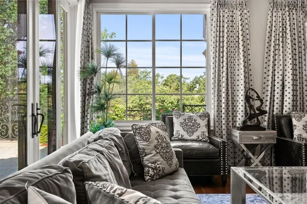 a bedroom with a bed a table and chair