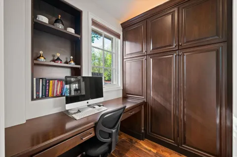 a living room with furniture wooden floor and a flat screen tv