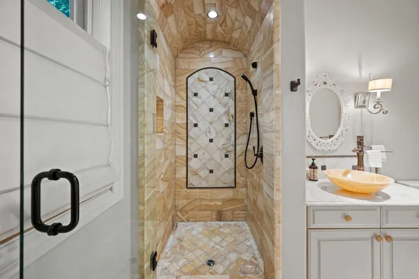 a view of a house with a big yard potted plants and large tree