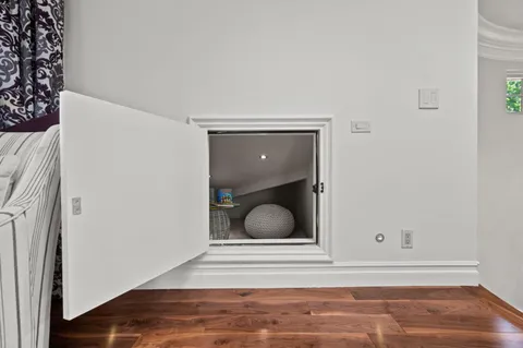 a bathroom with a shower and a glass door