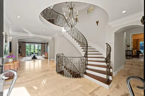 a living room with furniture gym equipment and view of living room