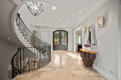 a living room with furniture and painting on the wall