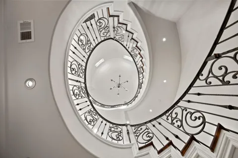 a lobby with furniture and large windows