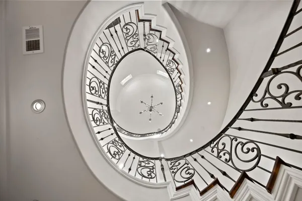 a lobby with furniture and large windows