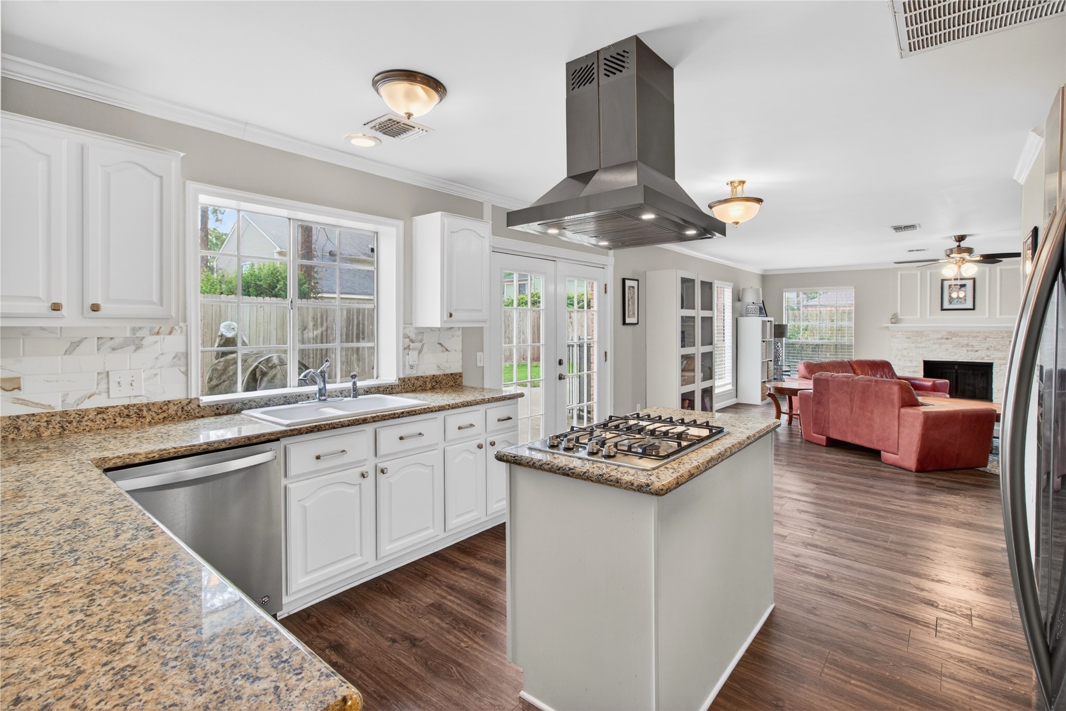 20214 Woodsboro Court Spring, TX 77388 - Photo 10 of 50 Recently Updated Kitchen! Painted cabinets, Stainless Appliances & Vent Hood, Tile Backsplash! Recently Painted Interior! Luxury Vinyl Plank throughout 1st Floor!