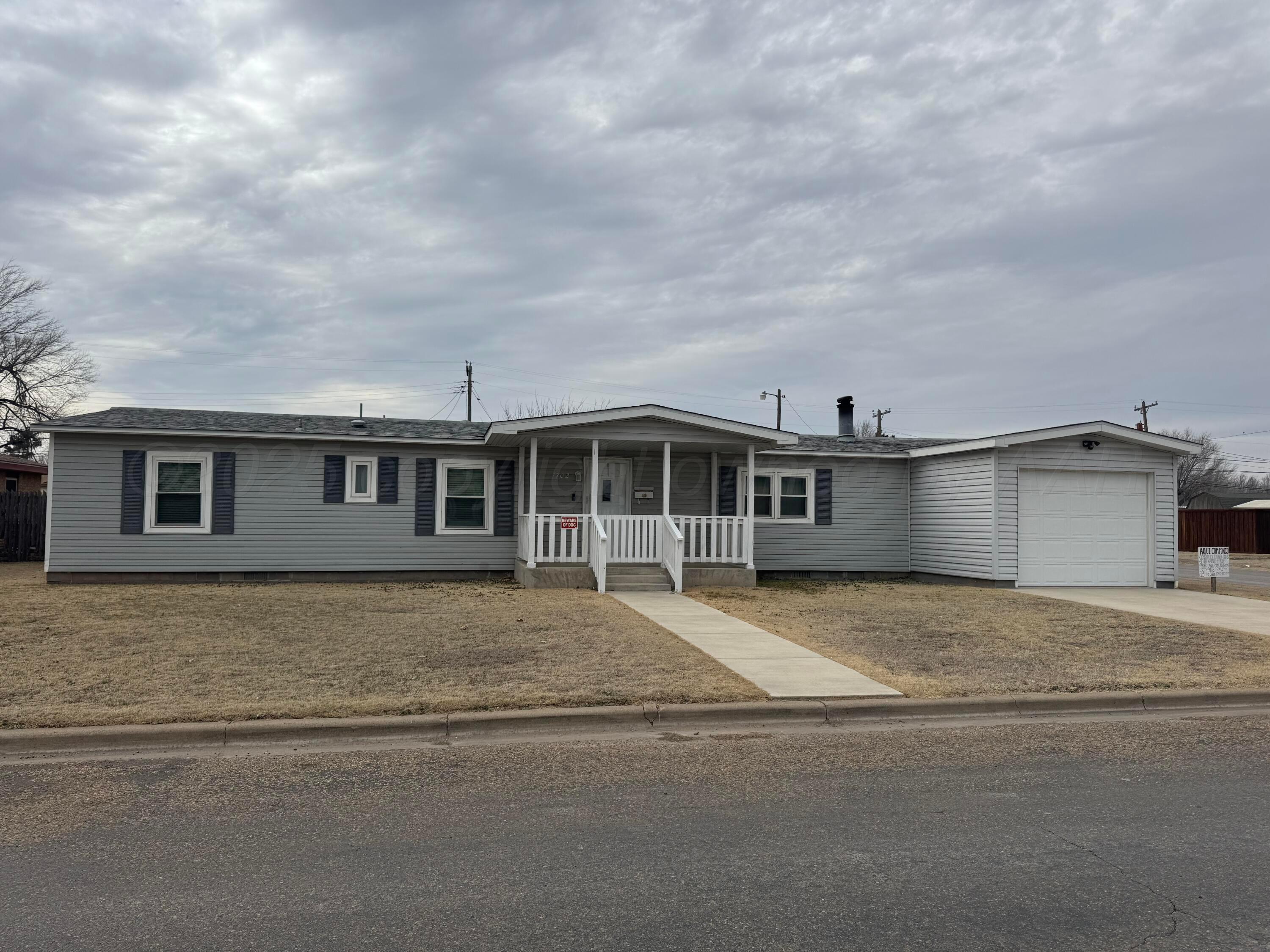 a house view with a garden space