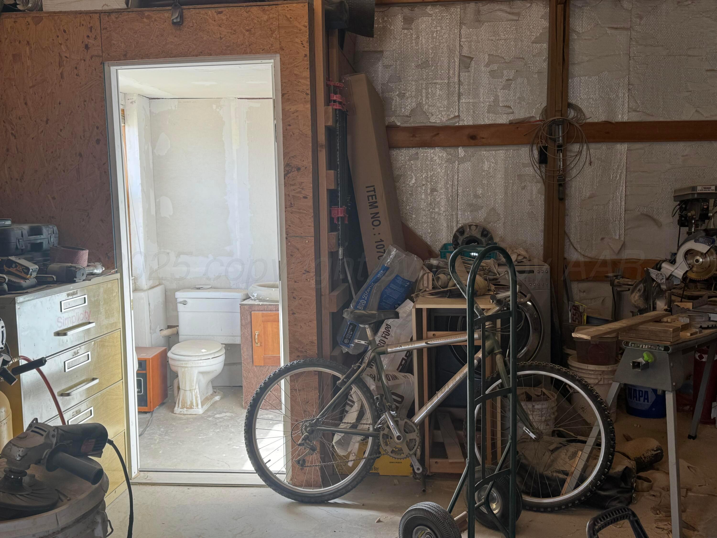 1702 South Baylor Street Perryton, TX 79070 - Photo 12 of 29 a view of a room with gym equipment