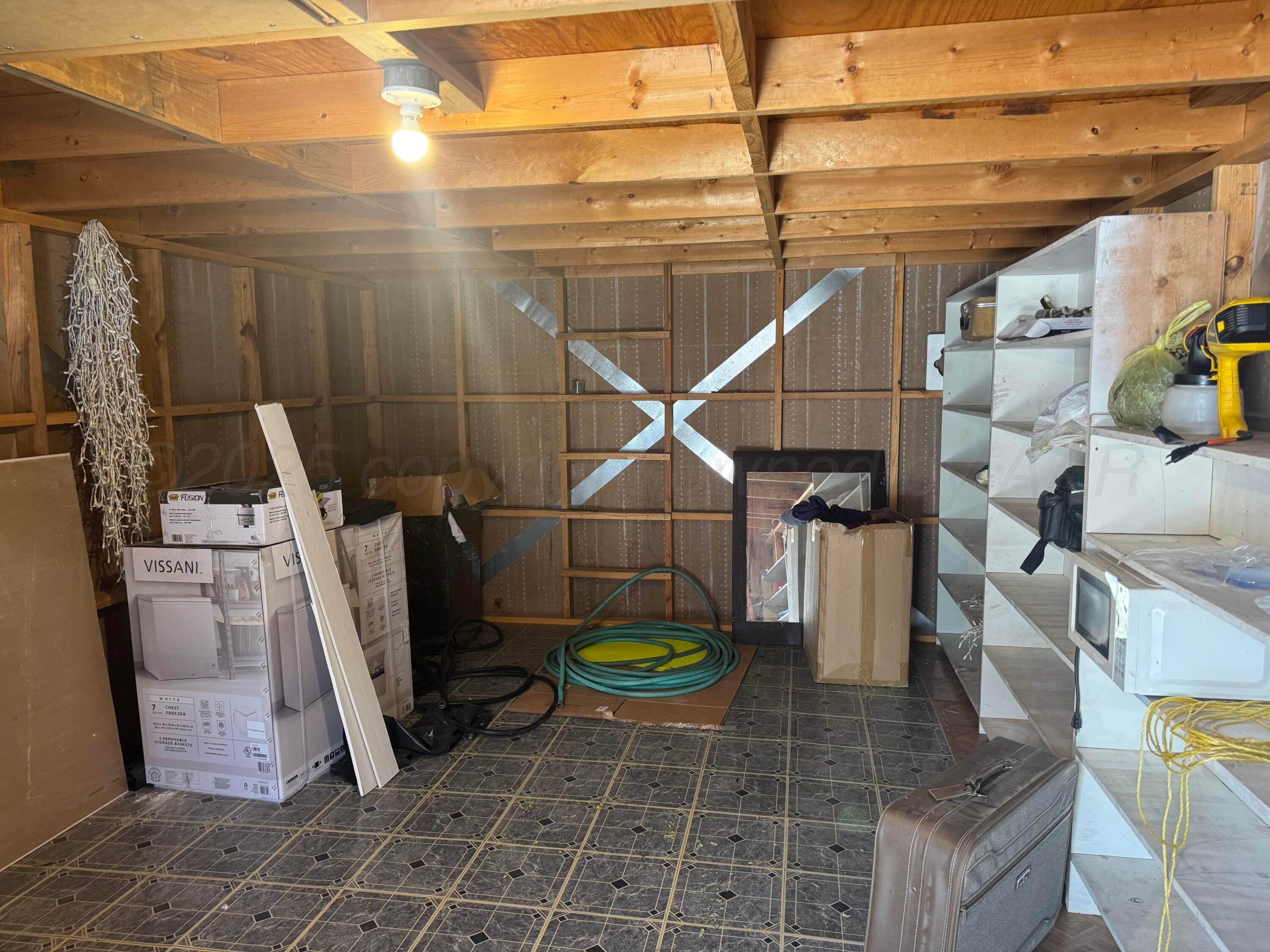 1702 South Baylor Street Perryton, TX 79070 - Photo 13 of 29 a view of a storage & utility room