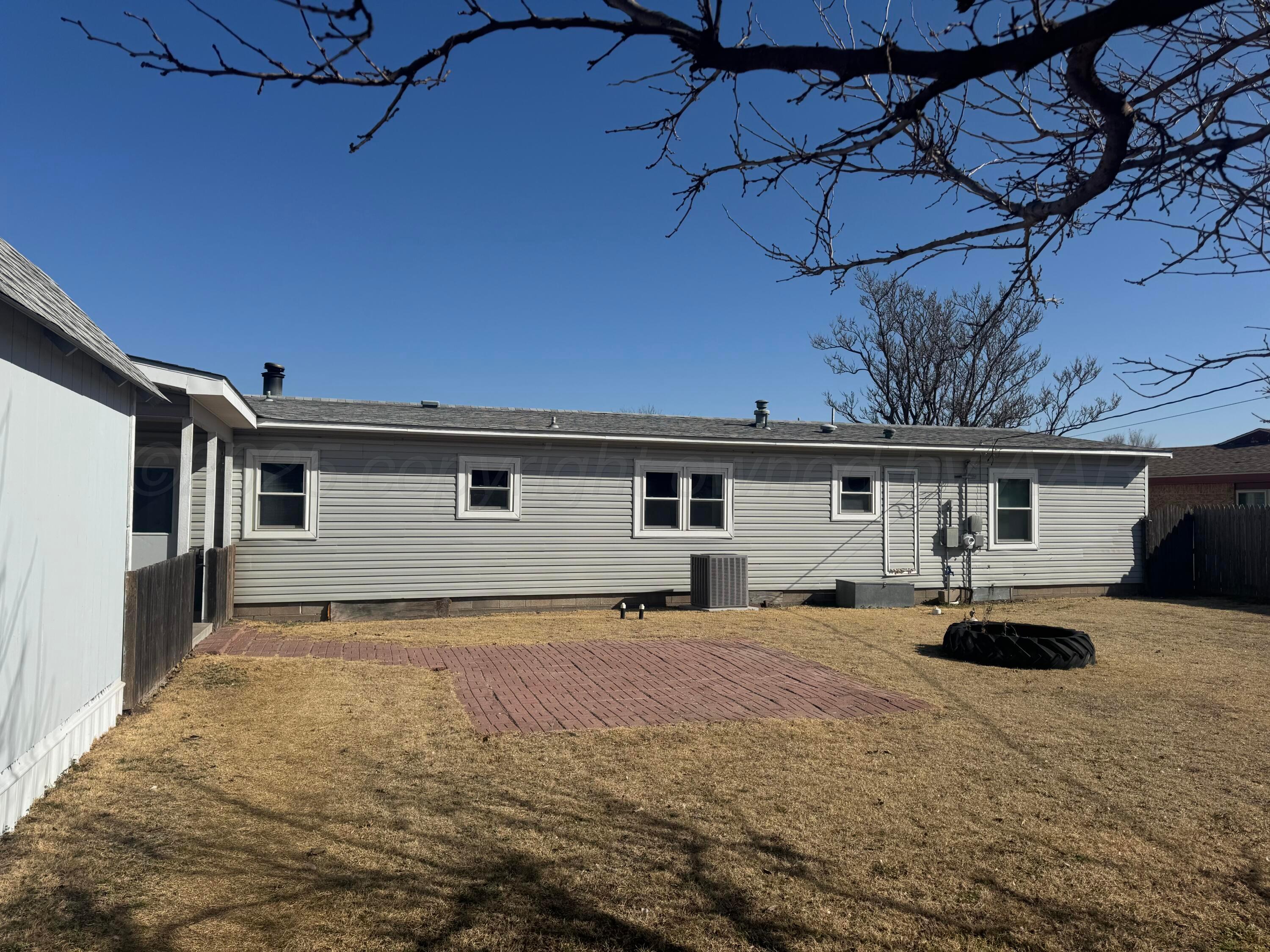 1702 South Baylor Street Perryton, TX 79070 - Photo 6 of 29 a front view of a house with cars parked