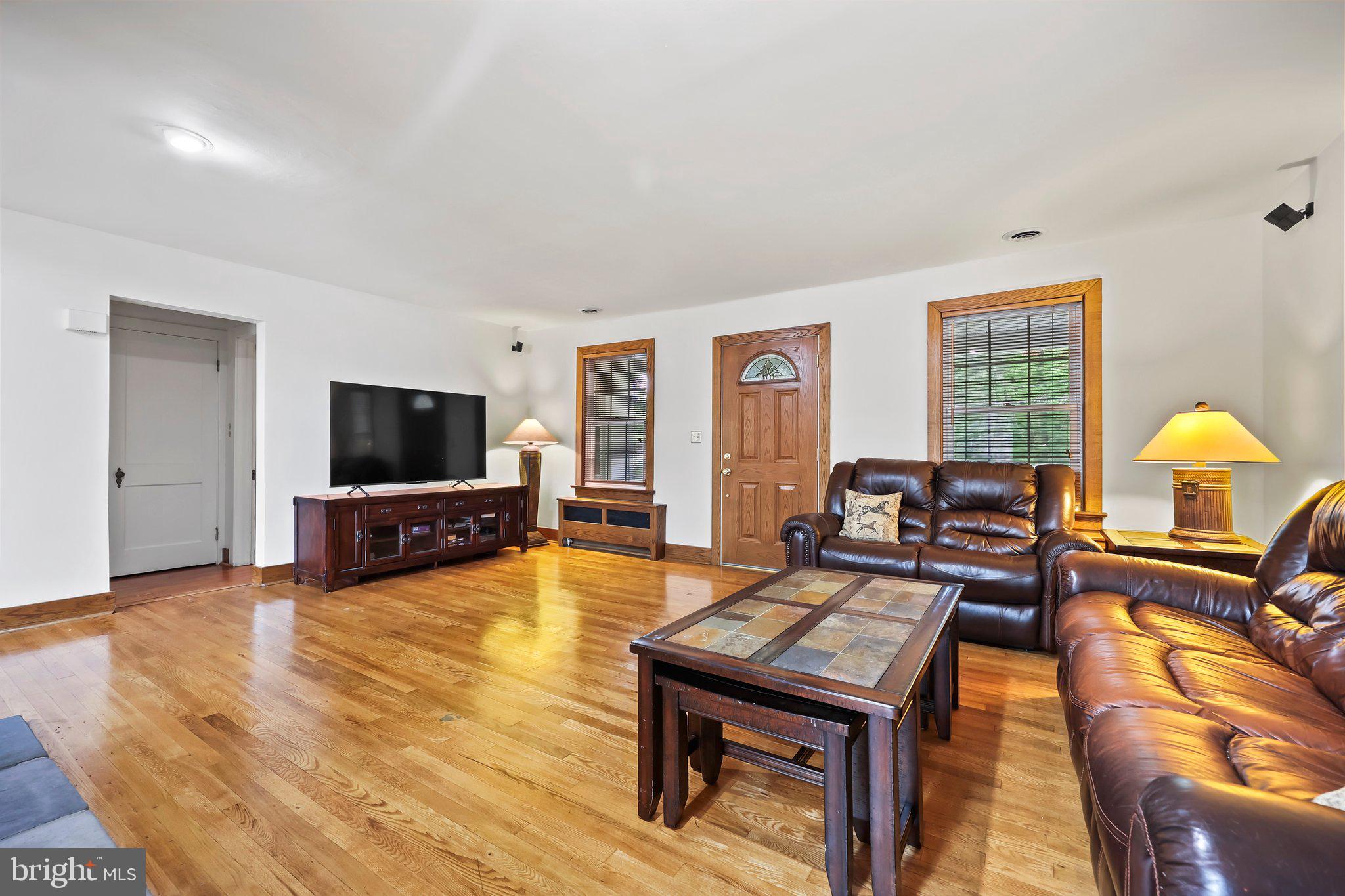 1218 Lower Ferry Road Ewing, NJ 08618 - Photo 12 of 39 a living room with furniture and a flat screen tv