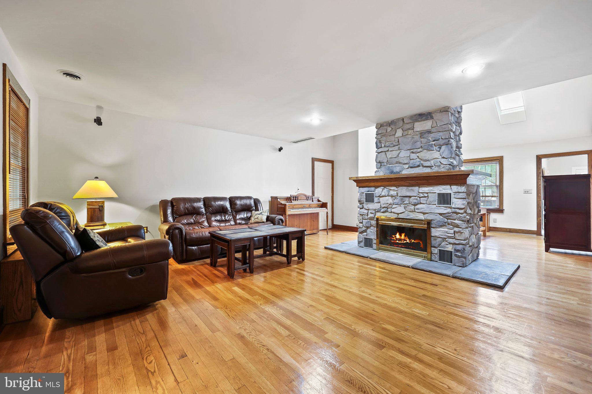 1218 Lower Ferry Road Ewing, NJ 08618 - Photo 13 of 39 a living room with furniture and a fireplace