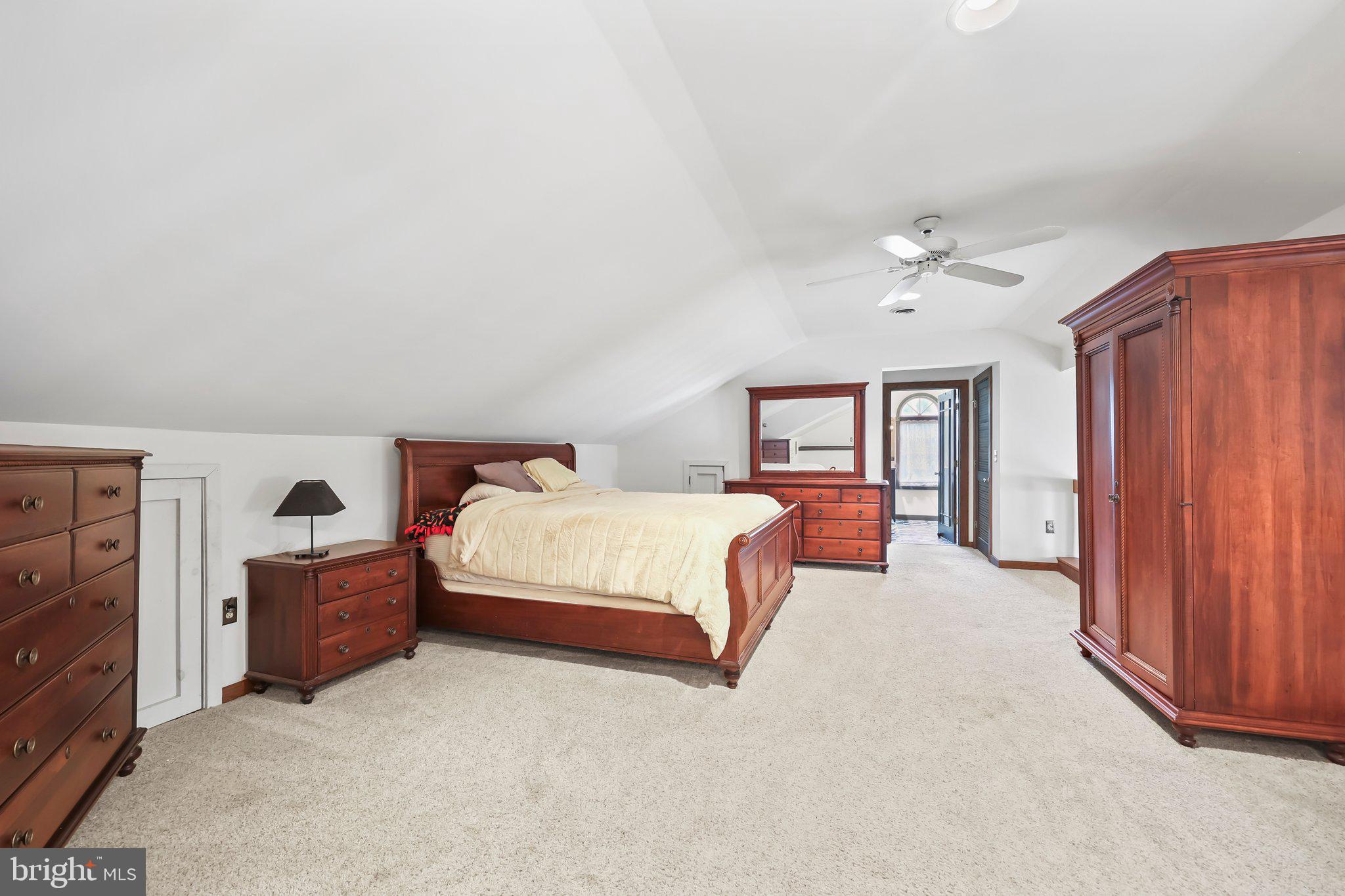 1218 Lower Ferry Road Ewing, NJ 08618 - Photo 19 of 39 a spacious bedroom with a bed and a view of closet