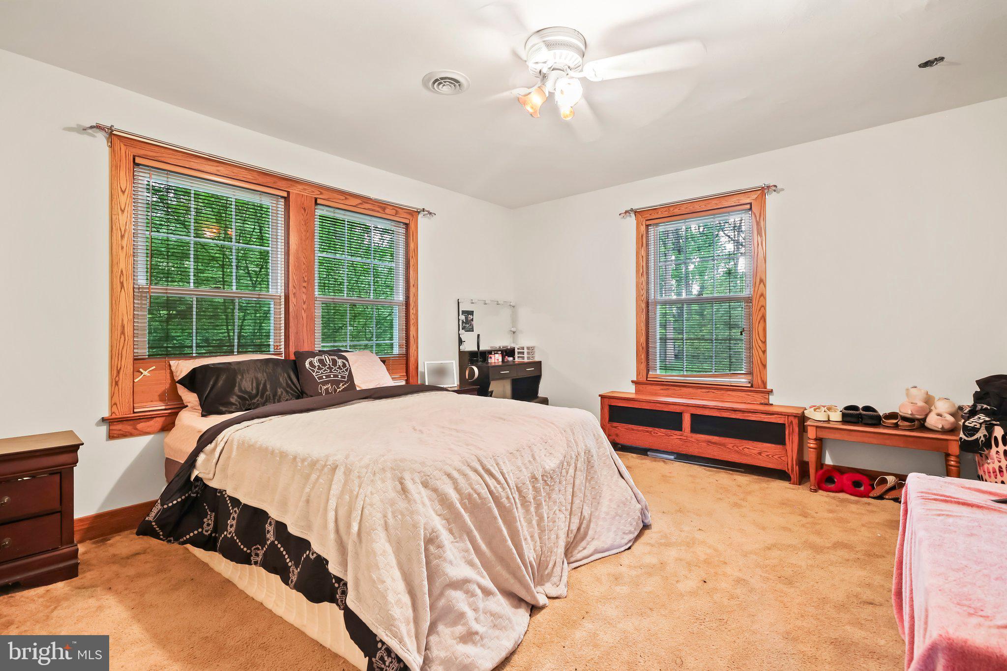 1218 Lower Ferry Road Ewing, NJ 08618 - Photo 24 of 39 a bedroom with a bed and a large window