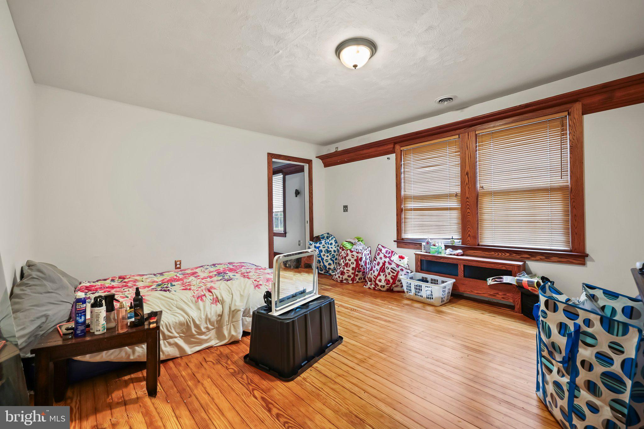 1218 Lower Ferry Road Ewing, NJ 08618 - Photo 26 of 39 a bed room with furniture and a window