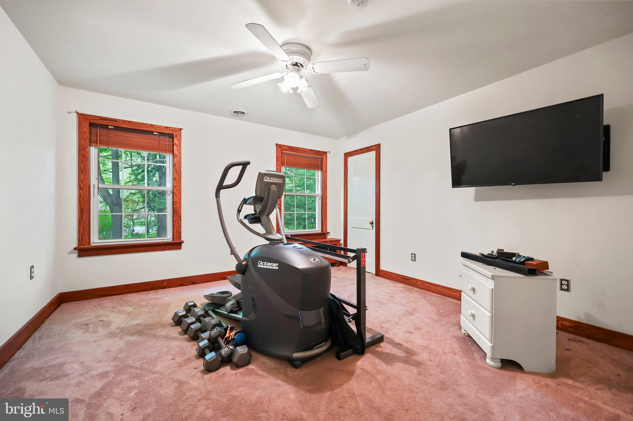 1218 Lower Ferry Road Ewing, NJ 08618 - Photo 28 of 39 a living room with furniture a flat screen tv and a window