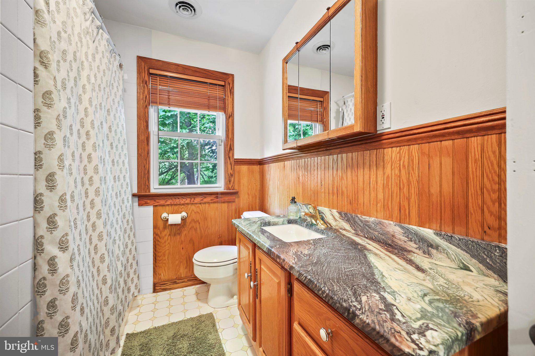 1218 Lower Ferry Road Ewing, NJ 08618 - Photo 29 of 39 a bathroom with a granite countertop sink and a toilet