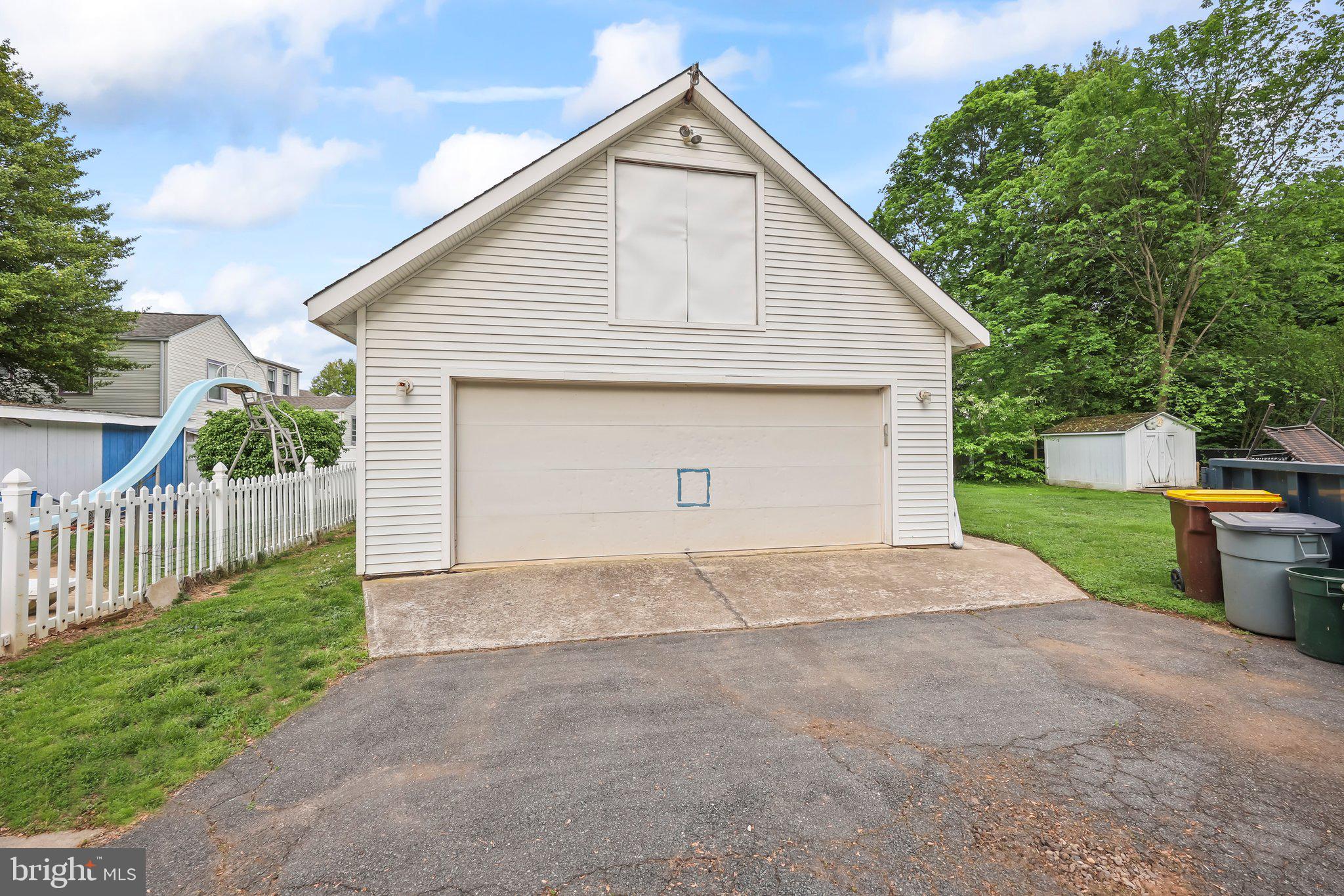 1218 Lower Ferry Road Ewing, NJ 08618 - Photo 35 of 39 a view of backyard of house with wooden fence