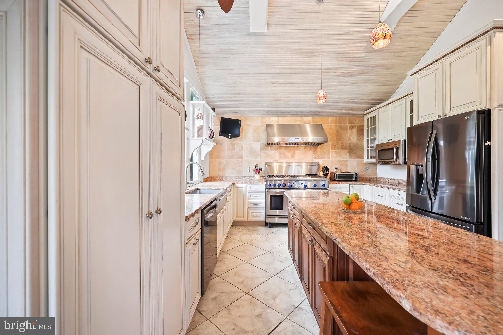 1218 Lower Ferry Road Ewing, NJ 08618 - Photo 5 of 39 a kitchen with stainless steel appliances granite countertop a refrigerator and a stove