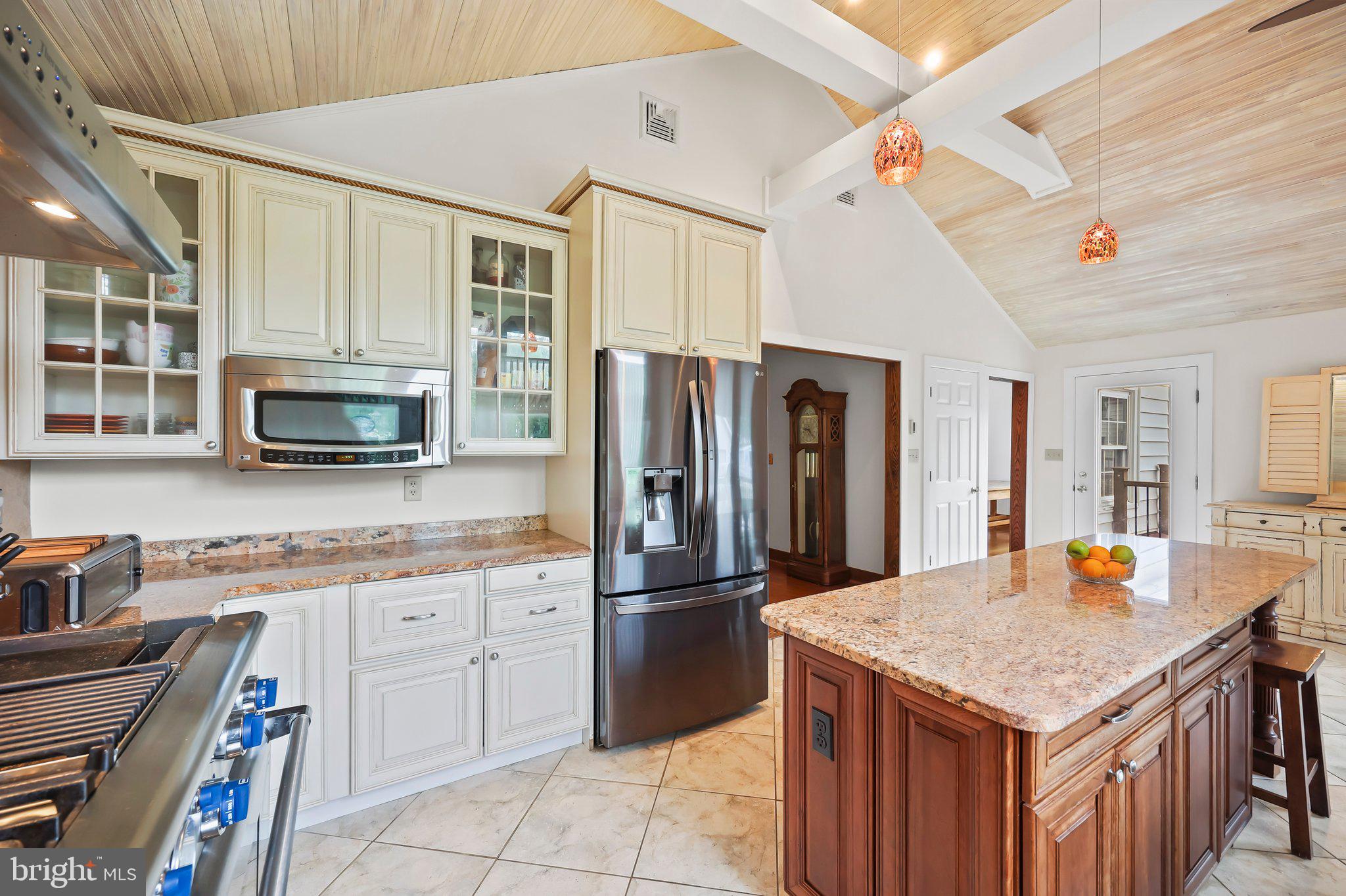 1218 Lower Ferry Road Ewing, NJ 08618 - Photo 8 of 39 a kitchen with a stove a refrigerator and a sink