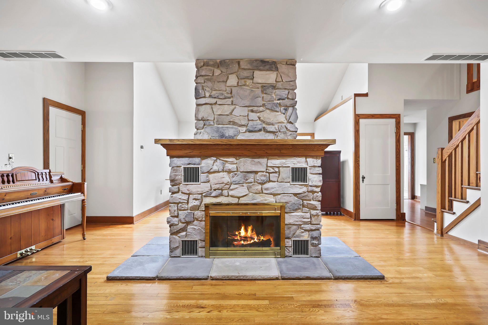 1218 Lower Ferry Road Ewing, NJ 08618 - Photo 10 of 39 a living room with furniture and a fireplace