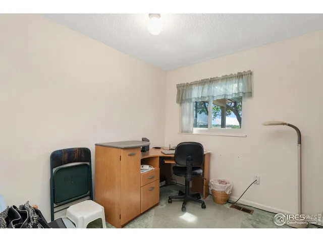 a workspace with furniture and window