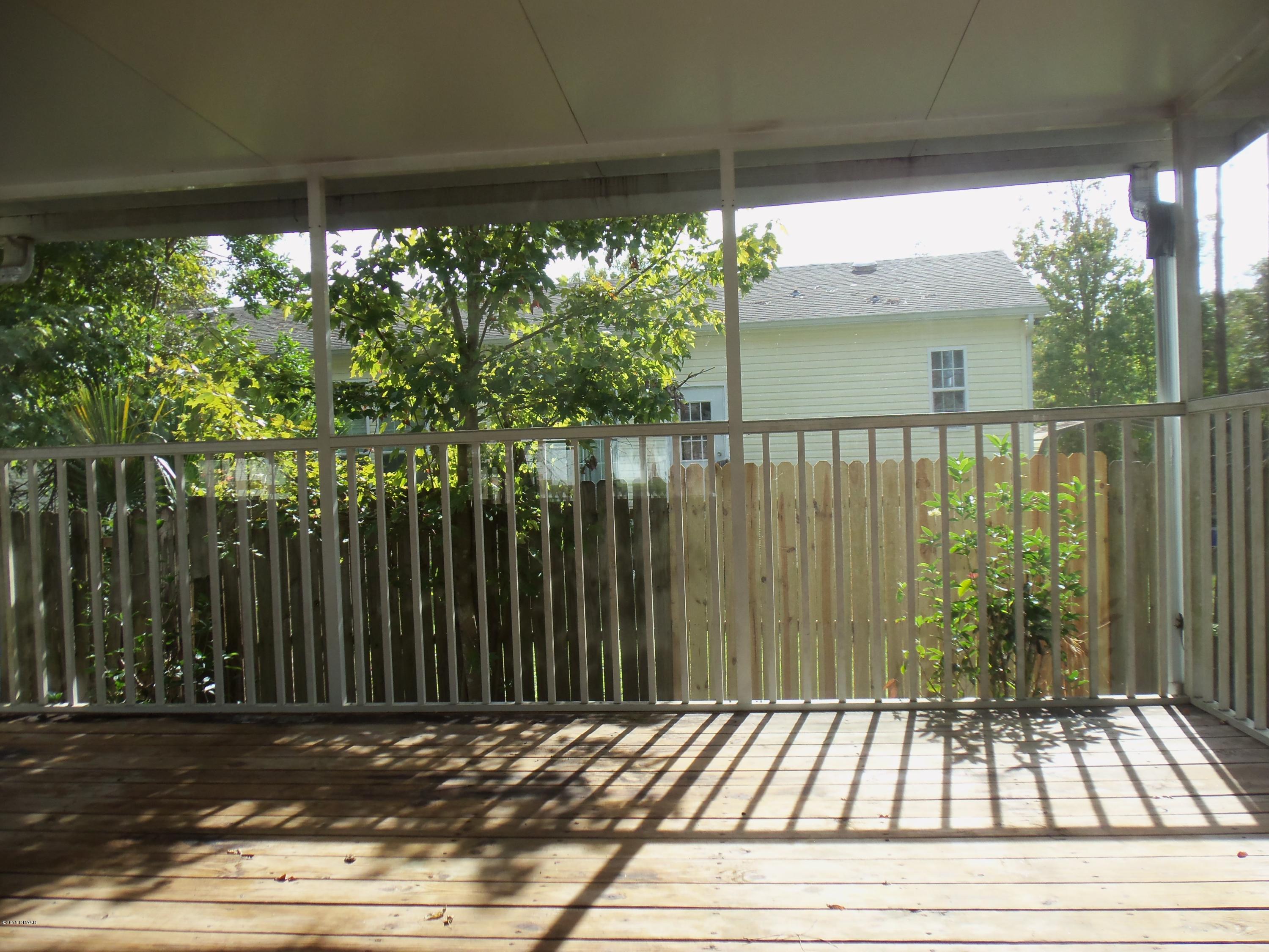 23926 Deer Road Astor, FL 32102 - Photo 13 of 16 Screened patio