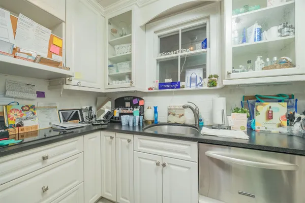 a kitchen with sink and cabinets