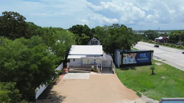 an aerial view of a house having yard