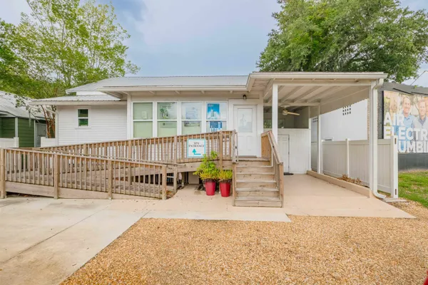 front view of a house with a patio