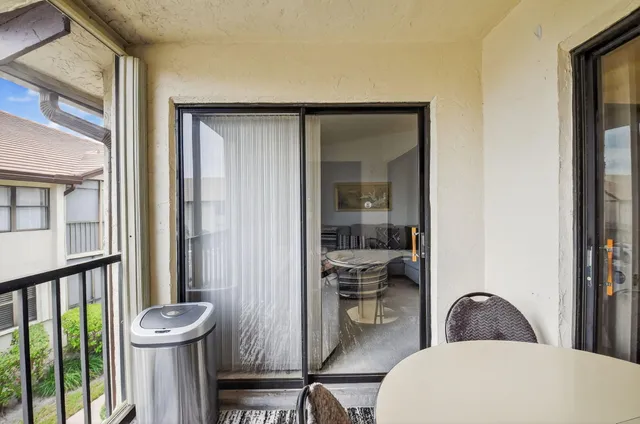 a bathroom with a toilet a sink and a window