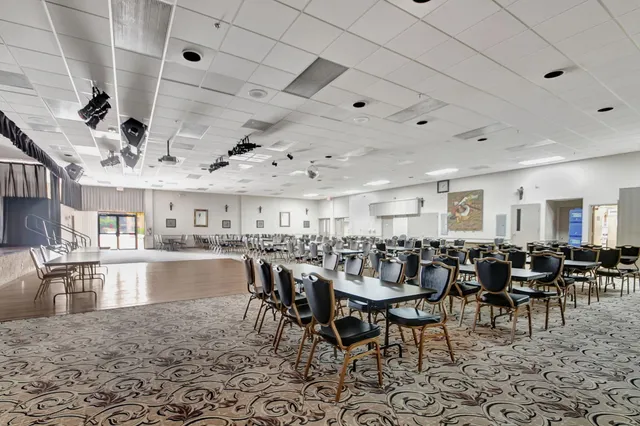a outdoor patio with a table and chairs