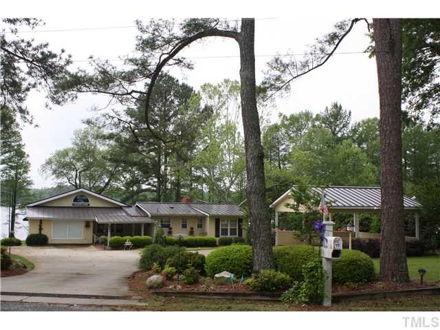 991 Country Club Road Smithfield, NC 27577 - Photo 1 of 16 Gorgeous Ranch On GREAT HOLT'S LAKE LOT