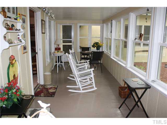 991 Country Club Road Smithfield, NC 27577 - Photo 11 of 16 GREAT SUNPORCH--FOR RELAXING WITH COFFEE IN THE MORNING OR WINE IN THE EVENING-LOOKING AT SERENE HOLT'S LAKE