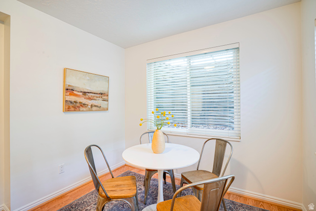 1433 Forge Way Draper, UT 84020 - Photo 21 of 29 Recessed window with horizontal blinds, light wood-finish flooring, and white baseboard trim