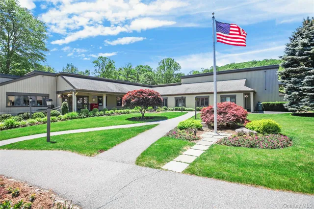 a view of a house with snow on the road