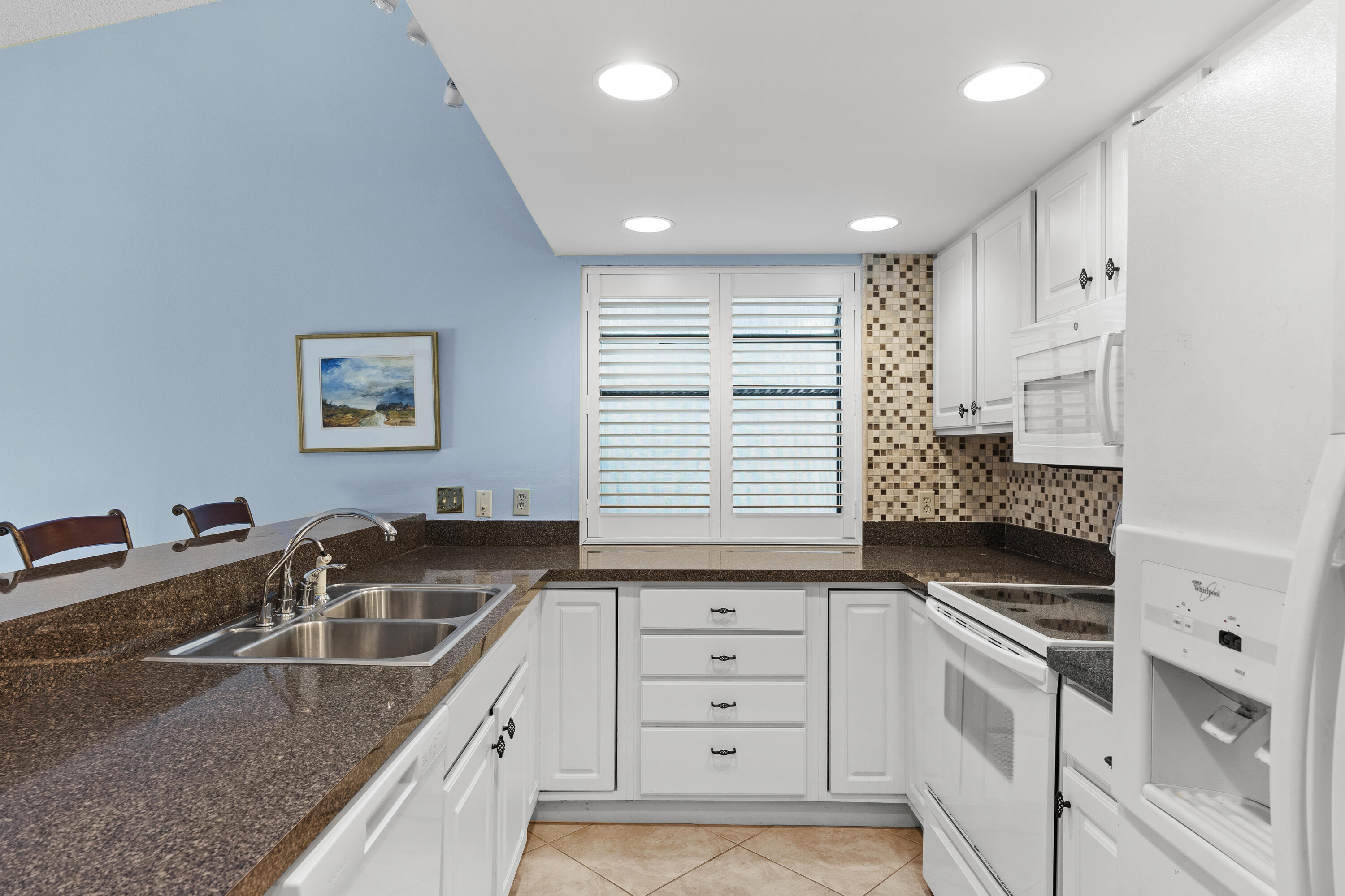 351 L'Atrium Drive Miramar Beach, FL 32550 - Photo 14 of 48 a kitchen that has a sink and cabinets