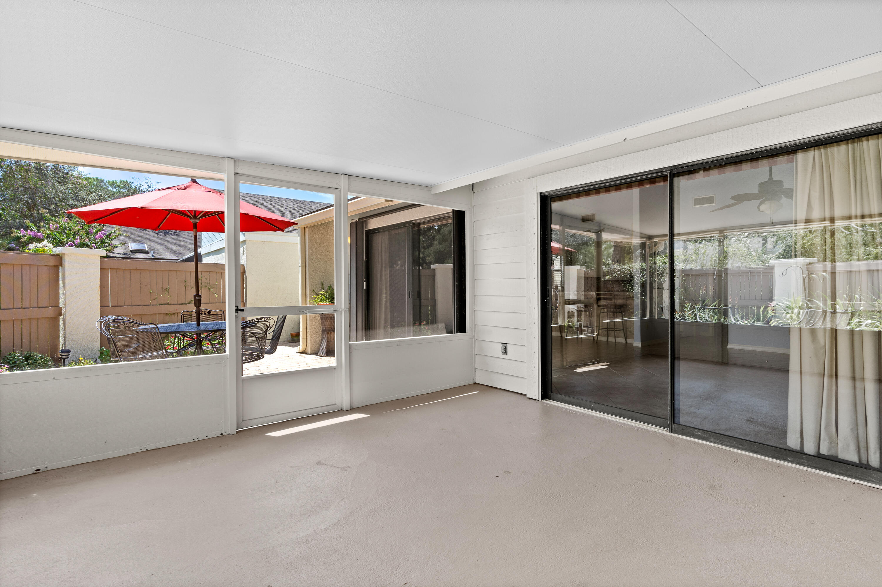 351 L'Atrium Drive Miramar Beach, FL 32550 - Photo 17 of 48 a view of a patio with a table and chairs under an umbrella