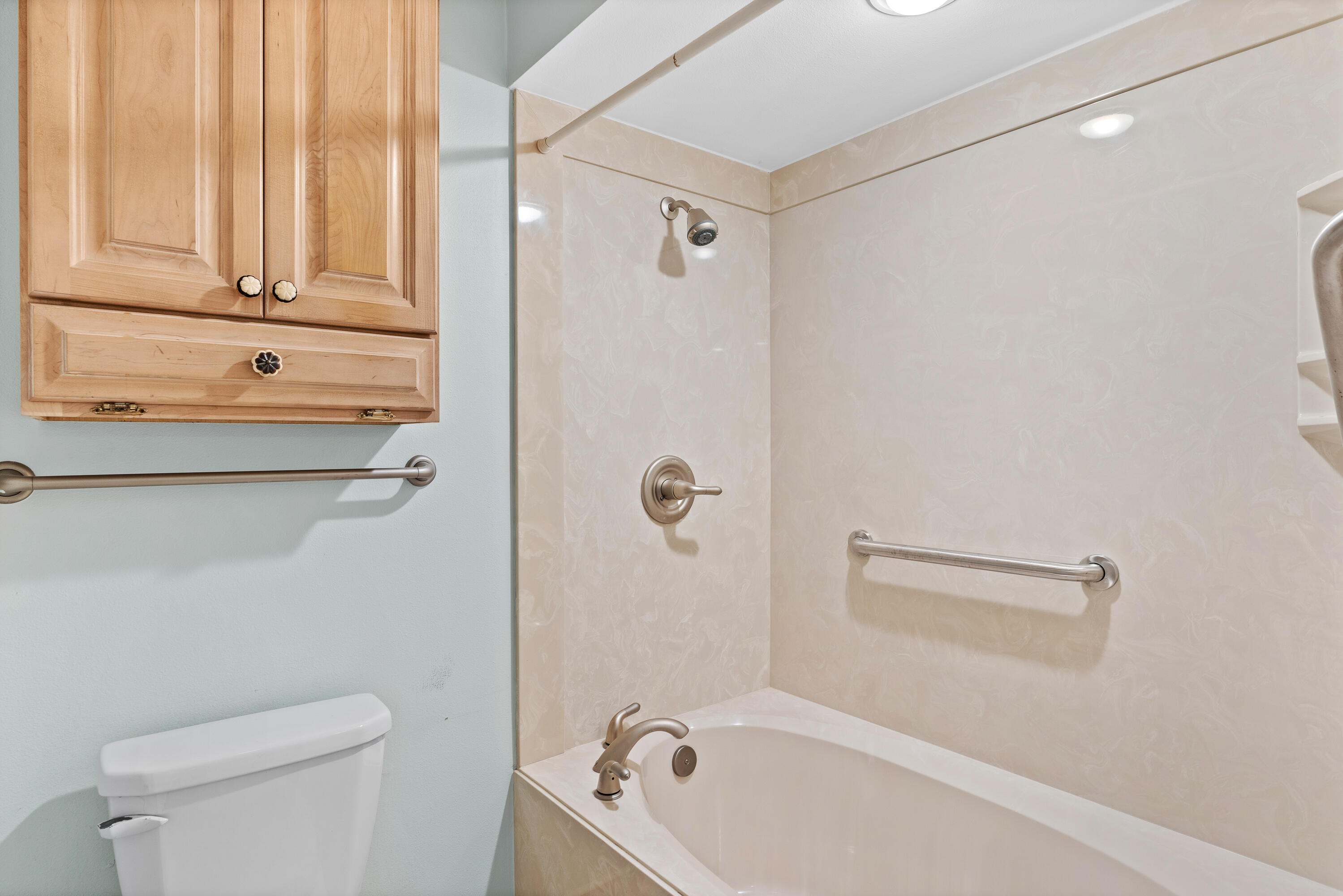351 L'Atrium Drive Miramar Beach, FL 32550 - Photo 22 of 48 a bathroom with a tub a toilet and a sink
