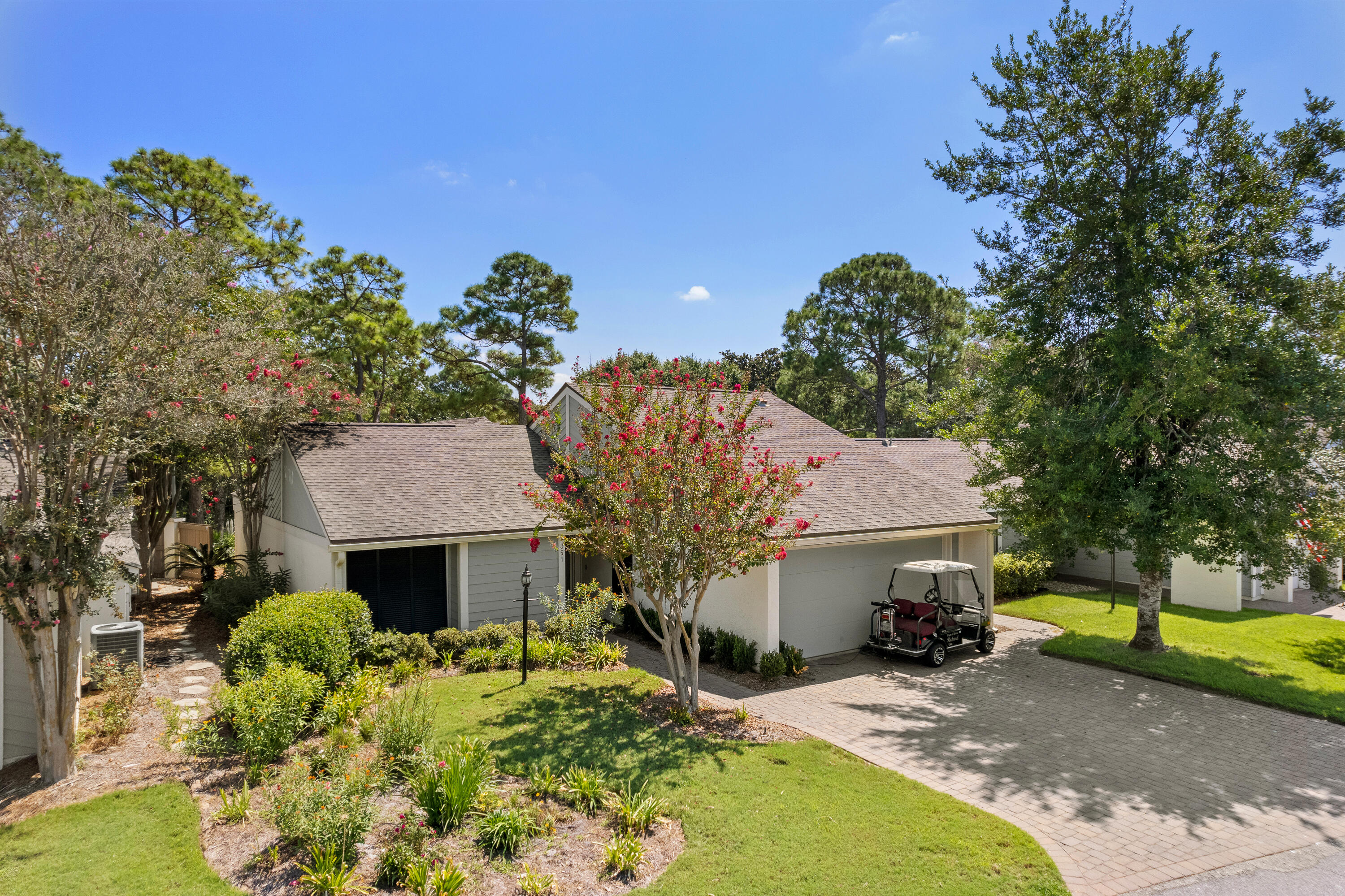 351 L'Atrium Drive Miramar Beach, FL 32550 - Photo 32 of 48 a front view of a house with a yard and garage