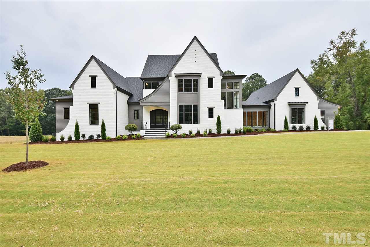 1417 Sky Vista Way Raleigh, NC 27613 - Photo 1 of 26 a front view of a house with swimming pool