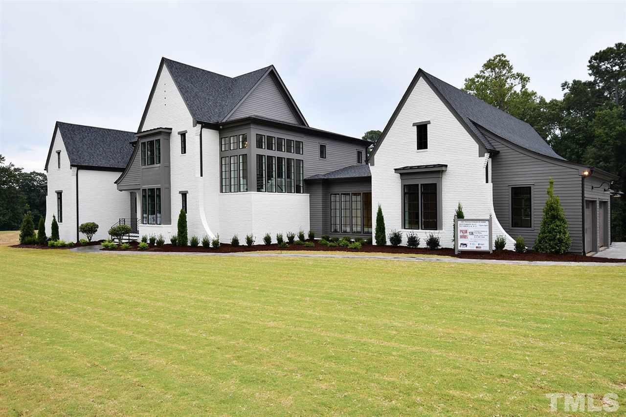 1417 Sky Vista Way Raleigh, NC 27613 - Photo 2 of 26 a view of a white house with a yard and plants