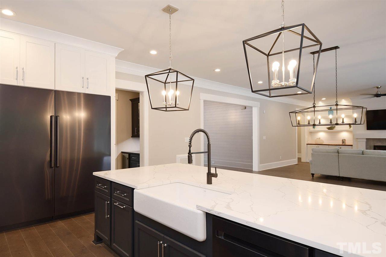 1417 Sky Vista Way Raleigh, NC 27613 - Photo 11 of 26 a kitchen with a sink and cabinets