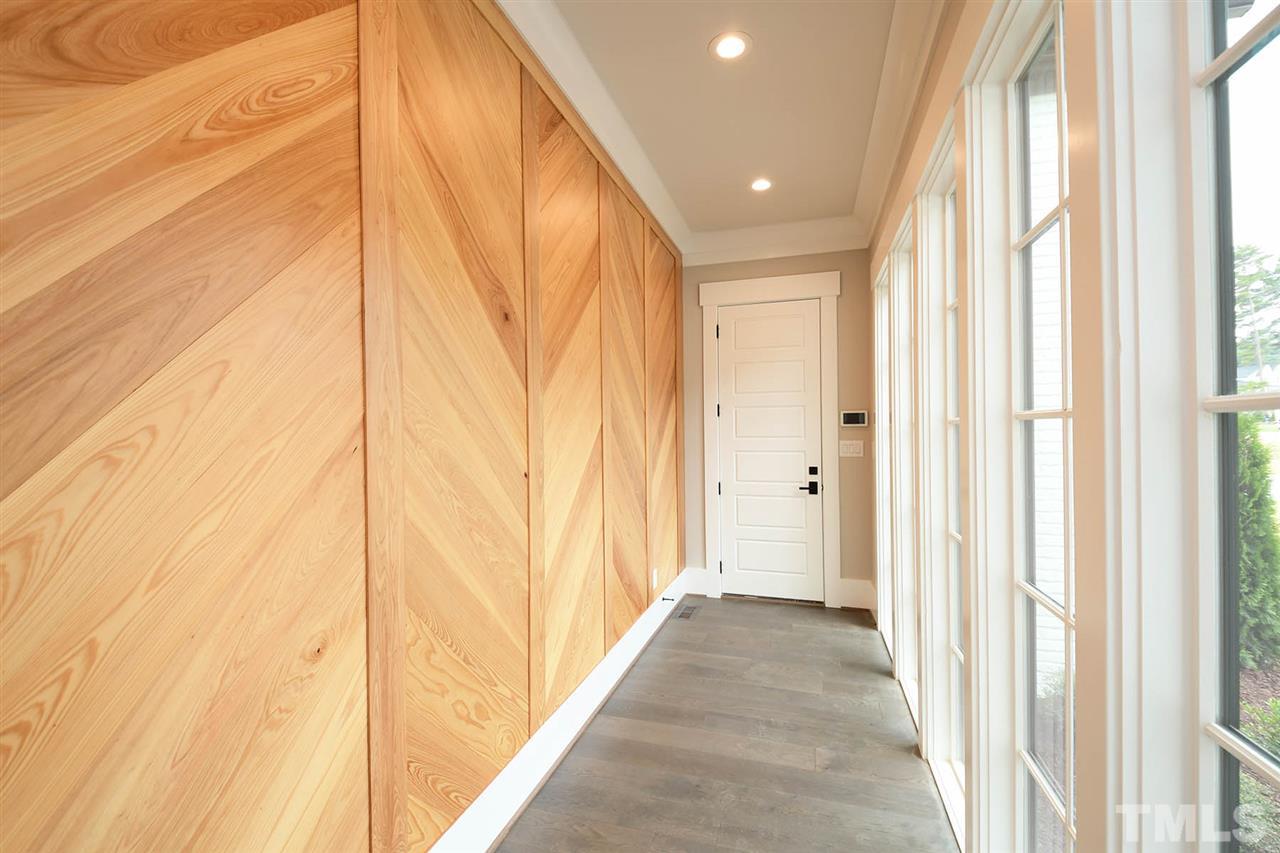 1417 Sky Vista Way Raleigh, NC 27613 - Photo 17 of 26 a view of a hallway with wooden floor and staircase