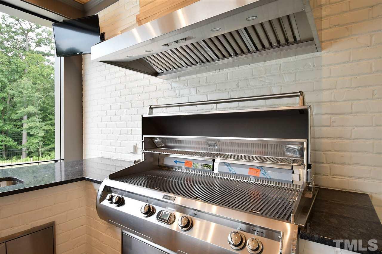 1417 Sky Vista Way Raleigh, NC 27613 - Photo 25 of 26 a stove top oven sitting inside of a kitchen
