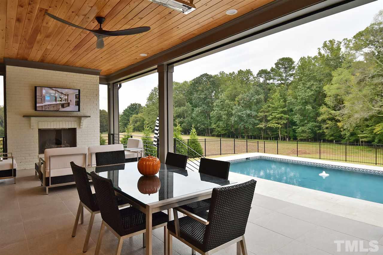 1417 Sky Vista Way Raleigh, NC 27613 - Photo 26 of 26 a outdoor dining space with furniture and garden view