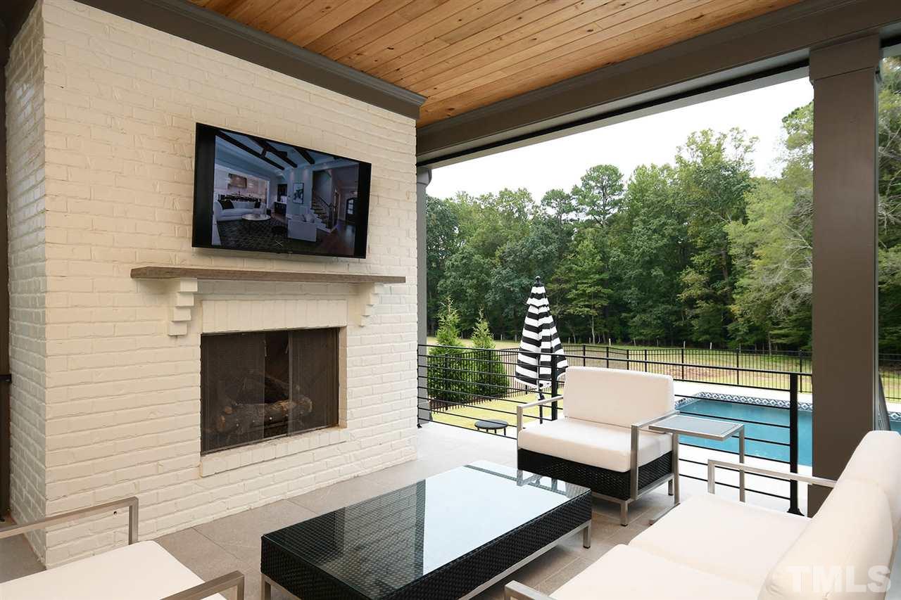 1417 Sky Vista Way Raleigh, NC 27613 - Photo 5 of 26 a outdoor living space with furniture and a fireplace