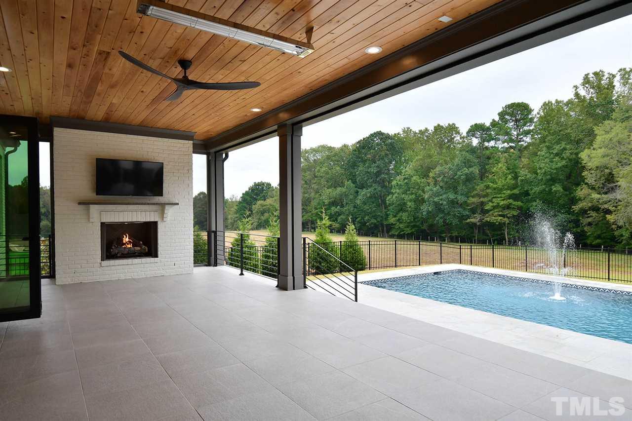 1417 Sky Vista Way Raleigh, NC 27613 - Photo 6 of 26 a view of an empty room with a fireplace