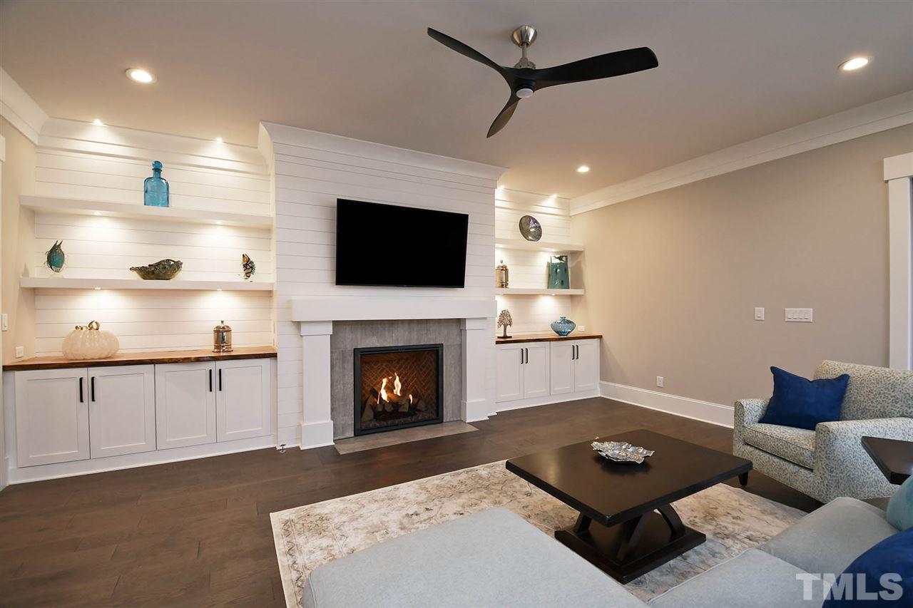 1417 Sky Vista Way Raleigh, NC 27613 - Photo 8 of 26 a living room with furniture and a fireplace
