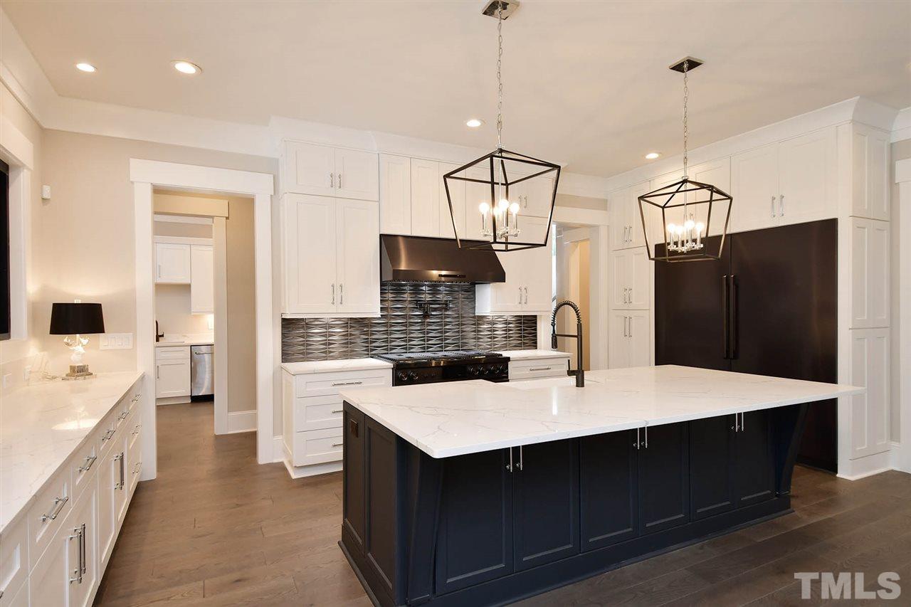 1417 Sky Vista Way Raleigh, NC 27613 - Photo 10 of 26 a kitchen with a refrigerator a sink and dishwasher