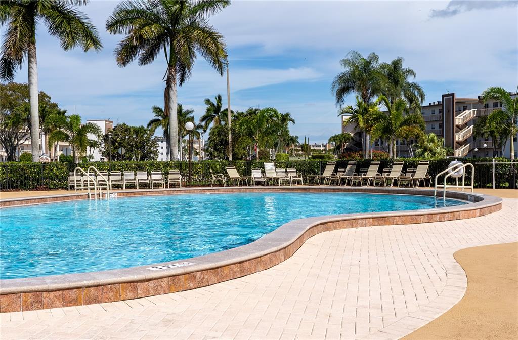 592 Fanshaw O, Unit 592 Boca Raton, FL 33434 - Photo 17 of 25 a view of a swimming pool with a lake